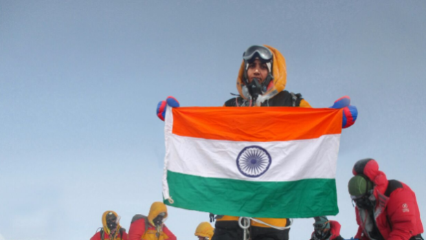 Tarkeshwari Rathod, in yellow gear, at the Everest summit.
