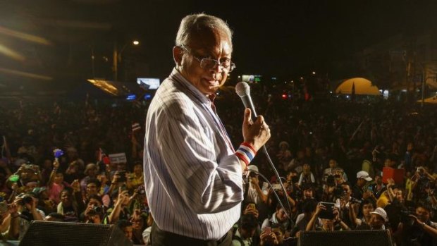 Bold move: Protest leader Suthep Thaugsuban addresses a crowd of anti-government protesters outside the Government House in Bangkok.