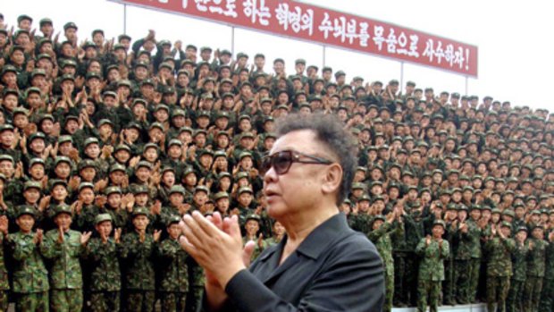 North Korean leader Kim Jong Il acknowledging applause from soldiers as he inspects the Korean People's Army Unit.