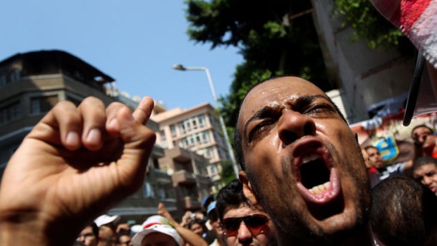 A protester shouts slogans against President Bashar al-Assad during a demonstration by a few hundred Egyptians and Syrians outside Syria's embassy in Cairo.