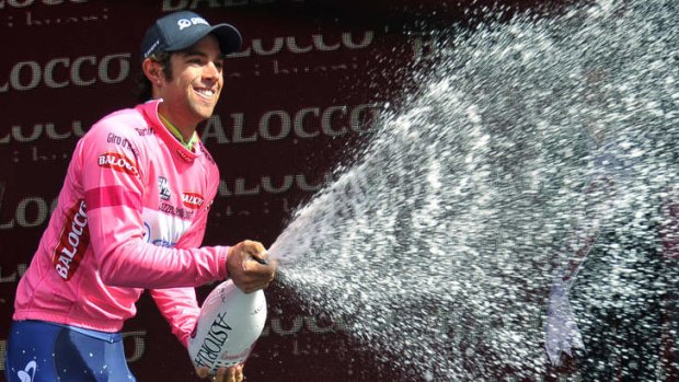 Australia's Michael Matthews celebrates on the podium after retaining the overall leader's pink jersey in Dublin.