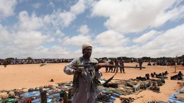 An Al Shabaab member with weapons believed to have been taken from peacekeepers during a battle last week.