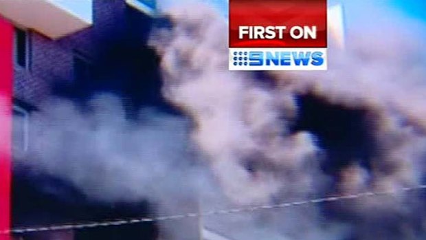 Screen grabs from Channel Nine of the fire at a Bankstown unit block that claimed one woman's life yesterday.