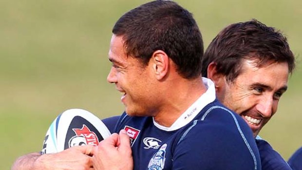 Mates no more ... Timana Tahu, left, and Andrew Johns joke around during a New South Wales training session before Origin I.