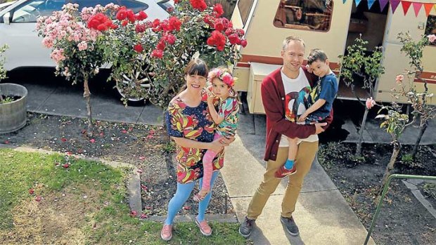 Road ready: Samone and Tim Bos at their Elsternwick home with their twins, Saffron and Jasper. They are about to take the caravan to Mildura on a camping weekend holiday.