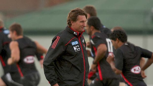 Flying high: Essendon coach James Hird watches his players at training yesterday.