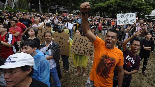 Worst off ... Singaporeans protest against a plan to increase its island population to 6.9 million by 2030 through immigration, claiming that it will affect quality of life.