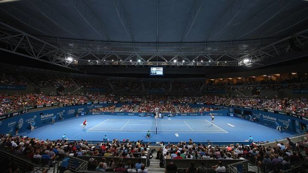 Roger Federer and Jarkko Nieminen play in front of a packed Pat Rafter Arena crowd.