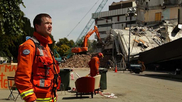 Terry Jewell of the Essex International Search and Rescue Team in front of the Pyne Gould building in Christchurch.