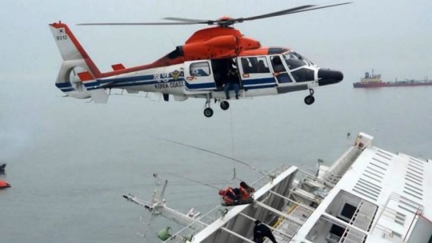 A maritime police helicopter rescues passengers who were on-board South Korean ferry "Sewol", which capsized off Jindo.