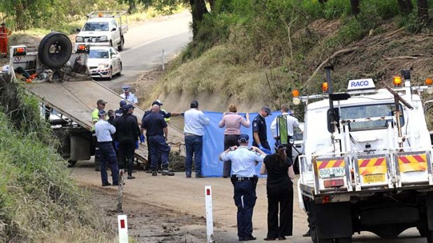 Police and emergency services at the scene where two bodies were discovered at Sandy Creek.