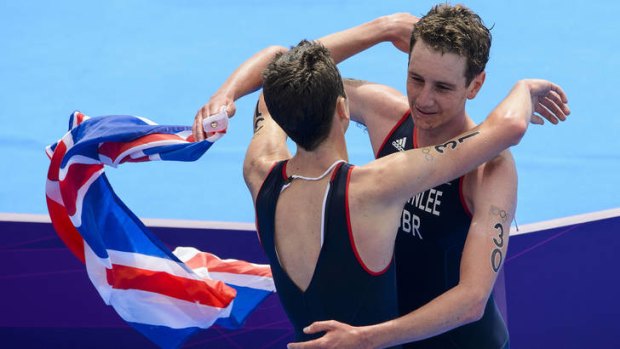 The Brownlee brothers congratulate each other after finishing the triathlon.