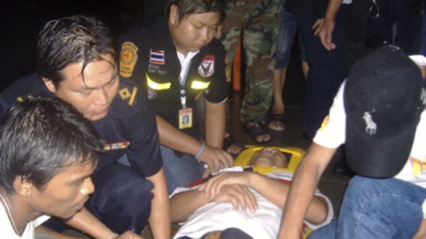 Rescue workers carry an injured victim to a hospital.