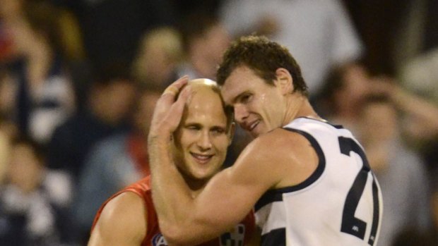Still feeling the love: Gold Coast's Gary Ablett and his former teammate, Geelong's Cameron Mooney.