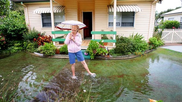 Welcome rain: Jan O'Loughlin at her house in Blacksmiths, Lake Macquarie.