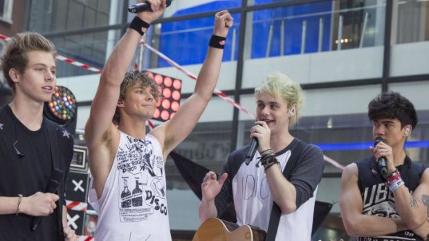 Fab 5 ... 5SOS salute the crowds during their appearance on the Today Show in New York.
