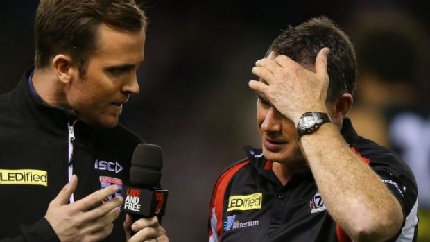 Saints coach Alan Richardson (right) is interviewed at three-quarter-time on Sunday.