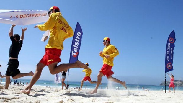 Full revs ahead . . . V8 Supercars drivers and surf lifesavers battled it out in a foot race at Bondi Beach yesterday. Surf Life Saving Australia is the charity partner that will benefit from Sydney's Telstra 500 V8 event next week.