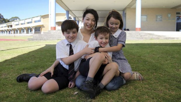 Keen to learn: Tomoko Houstone with her children John (year 5), Tom (year 1) and Hanako (year 3) at the Sydney Japanese International School.