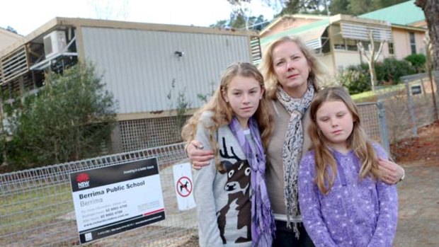 Gas fears . . . Katrina Walters with daughters Georgia and Olivia, who she has taken out of her Berrima School.