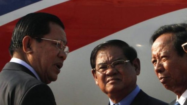 Initial agreement to take asylum seekers ... from left, Cambodian Prime Minister Hun Sen talks with Interior Minister Sar Kheng and Defence Minister Tea Banh.