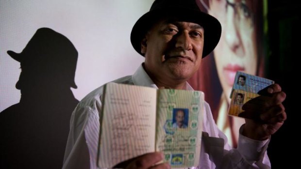 Poet Jamal Ali Al Hallaq with his fake passport and documents which helped him escape from Iraq. 