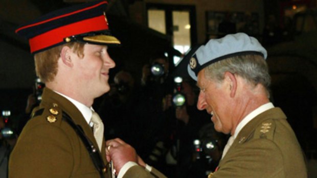 Flying high... Prince Harry was awarded his helicopter pilot's wings by his father Prince Charles at the Army Aviation Centre in Middle Wallop.