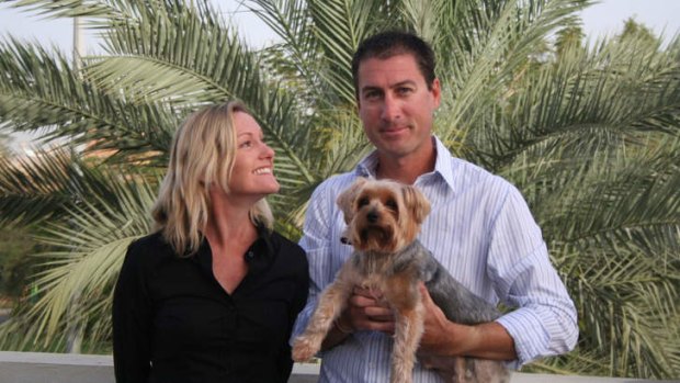 Marcus and Julie Lee in Dubai, with their dog Dudley.