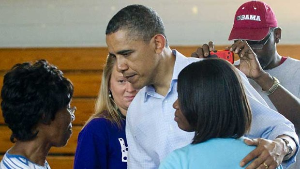 President Barack Obama meets residents of Holt, Alabama, at a relief centre.