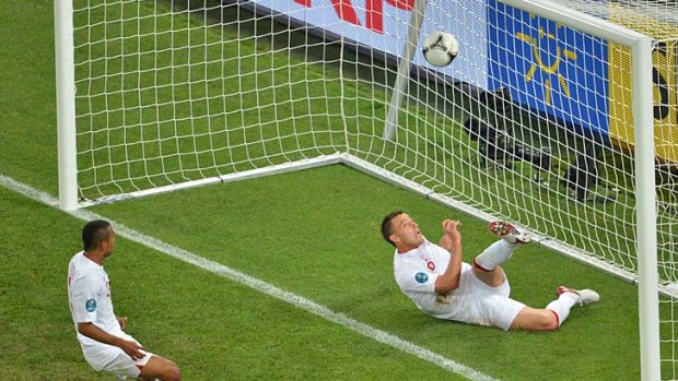 Controversial ... John Terry lies in the back of the goal after being given the benefit of the doubt by the match officials.