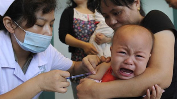 A child gets vaccinated for measles.
