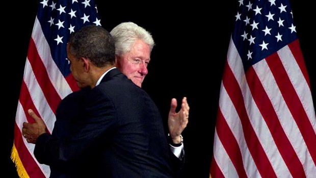 US President Barack Obama and former president Bill Clinton embrace at a New York fund-raising event.