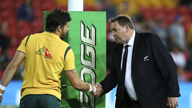 All Blacks coach Steve Hansen congratulates Adam Ashley-Cooper on reaching 100 Tests.