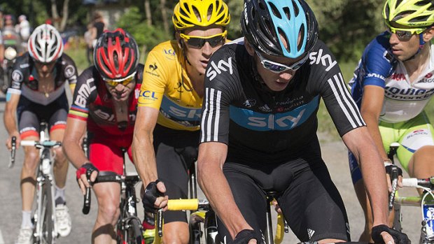 Rear view ...  Frank Schleck, Cadel Evans, overall leader Bradley Wiggins and Christopher Froome tackle the eleventh stage.
