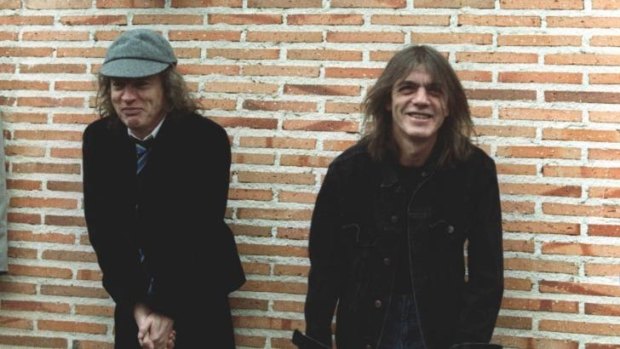 Malcolm Young, right, with his brother Angus, pictured here in 2000.