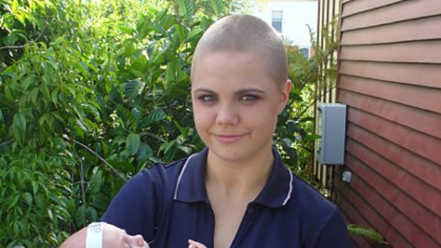 Suspended ... a photograph of Emily Pridham after she shaved her head to raise money for charity.