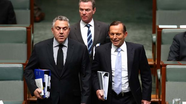 Under siege: Treasurer Joe Hockey, Christopher Pyne and Prime Minister Tony Abbott arrive for Question Time.