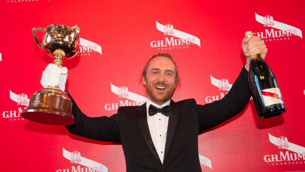 DJ David Guetta living it up in the Mumm marquee at the Melbourne Cup.