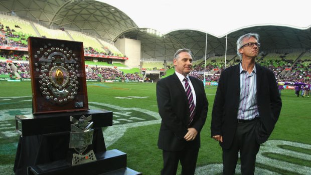 The Rewards ... Melbourne boss Ron Gauci, left with NRL chief David Gallop and the J.J. Giltenan Shield.