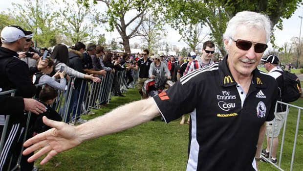 Fond farewell: Mick Malthouse acknowledges the Magpie supporters who turned out yesterday to commiserate with the Collingwood team.