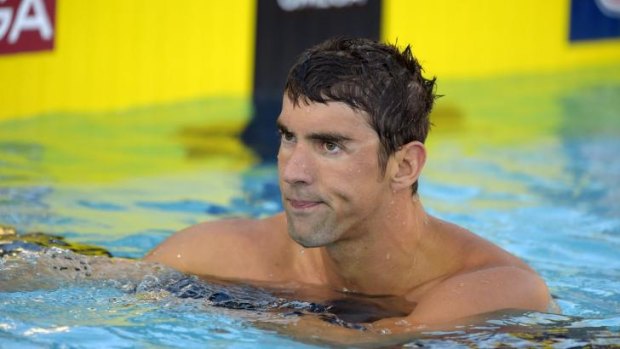 Michael Phelps looks on after taking seventh in men's 100 meter freestyle final at the U.S. nationals.
