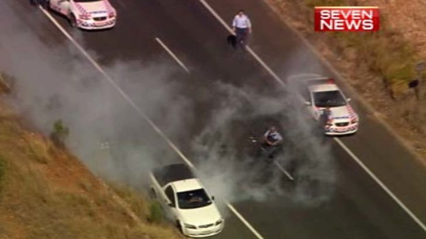 Police converge on the allegedly stolen ute.