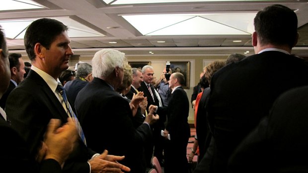 Campbell Newman meets and greets MPs and candidates, while fallen deputy leader Lawrence Springborg (left) looks on glumly.