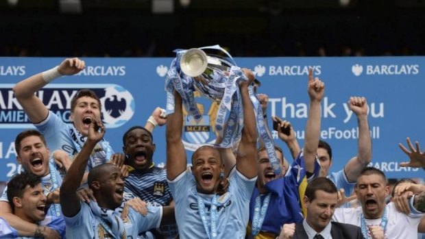 Manchester City's captain Vincent Kompany celebrates after winning the English Premier League title.