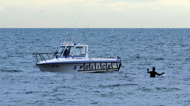 Police divers take to the water in search of Mr Houston at Brighton.