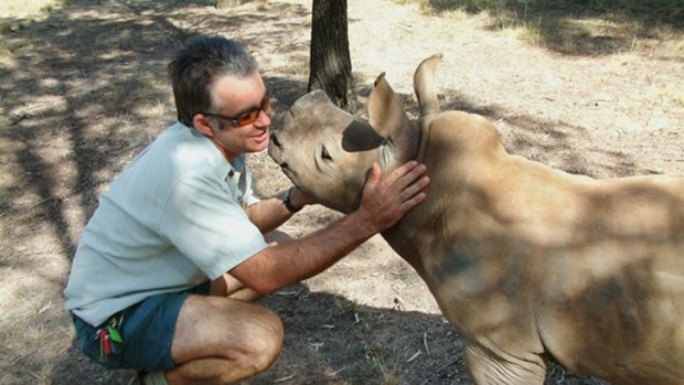 Taronga Western Plains Zoo’s senior vet Benn Bryant with hand-raised white rhino calf Amira, photographed in April 2005. Amira was one of four rhinos that died suddenly at the zoo.