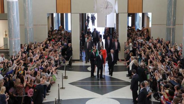 Phone cameras at the ready: The marble foyer at Parliament House was full of people hoping to catch a glimpse of the royal couple.