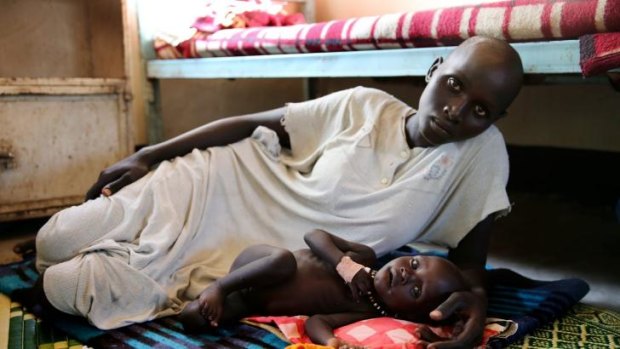 Nyjuok Reath, 22, with her son Chan Kim, 9 months, in Akobo hospital.