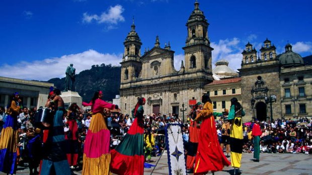 Colourful ... street theatre performance in the Plaza de Bolivar in Bogata.