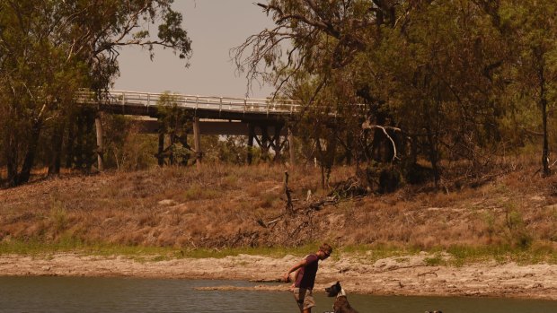 Cooling off amid extreme heat in the Barwon-Darling River near Bourke in January. The town is likely to switch entirely to bore water next month amid record low flows for Australia's longest river.